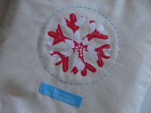 Snowflake applique on front of gift set calico bag